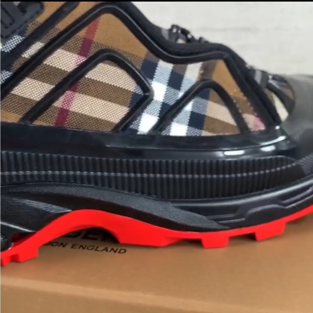 Burberry red bottoms for sale $500 size 11 brown, white, and black stripes.